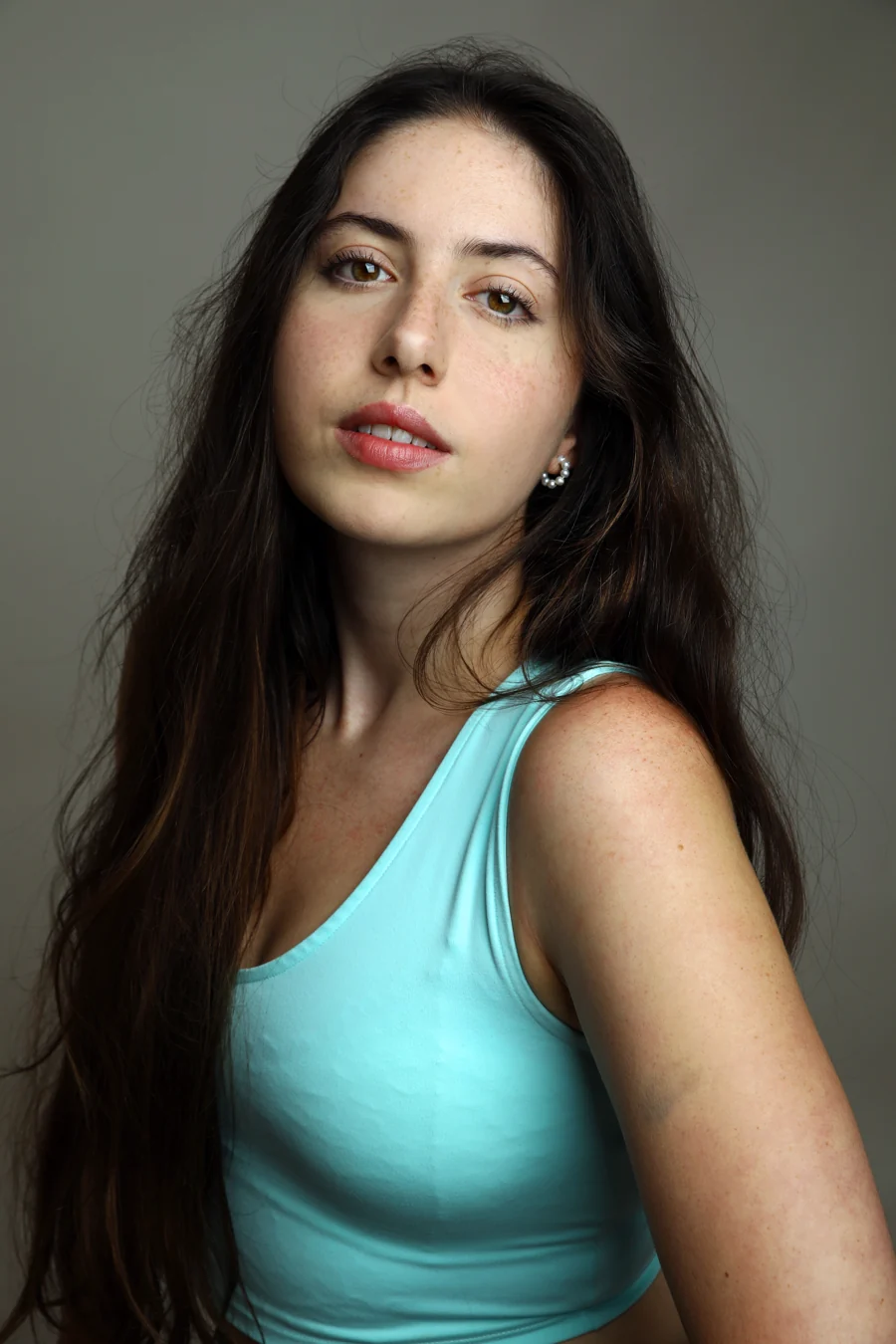 Three-quarter portrait in a mint tank top